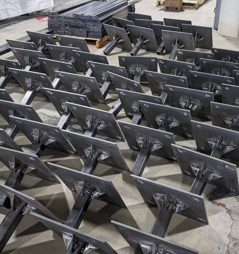 Fabricated steel components staged inside the Weldworx shop